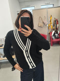Cardigan bicolore con bottoni
